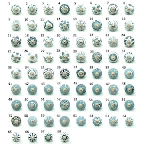 May include: A collection of 68 decorative ceramic cabinet knobs in various designs. The knobs are primarily white and blue, with floral, geometric, and abstract patterns. Each knob has a metal base for easy installation. Ideal for updating furniture.