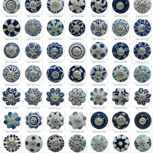 May include: A collection of navy blue and white ceramic cabinet knobs with various floral and geometric designs. Each knob has a silver-colored metal base. The knobs are labeled with the text "NAVY BLUE" followed by a number.