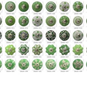 May include: A selection of green ceramic cabinet knobs with diverse patterns, such as solid hues, floral motifs, and dotted designs. Each knob features a silver-toned metal base and is labelled with "GREEN" and a number.