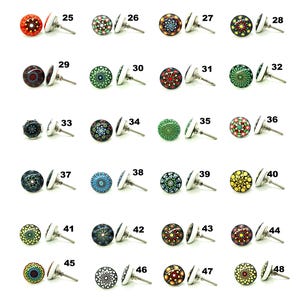 May include: A selection of decorative cabinet knobs with colourful, patterned designs. Each knob features a round, painted face with a silver-toned base and a metal screw. The knobs are numbered 25 to 48.