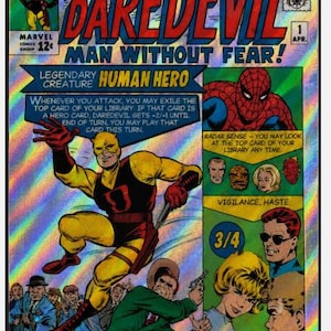 May include: A rectangular holographic trading card featuring a comic book cover design titled Here Comes Daredevil Man Without Fear. The card displays a yellow and red costumed hero, Spider-Man, and various character portraits with game text.