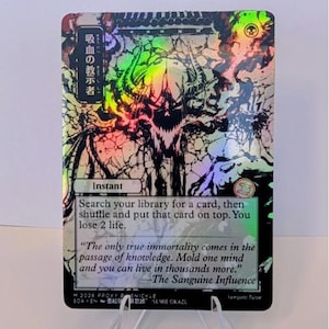 May include: A holographic trading card featuring a dark, horned skull illustration with Japanese text in the top left corner. The card text reads: Search your library for a card, then shuffle and put that card on top. You lose 2 life.