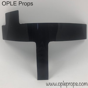 May include: Black plastic T-shaped prop for cosplay or theatrical productions. The prop is made of a durable, lightweight plastic and is designed to be easily attached to costumes or props.