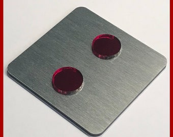 May include: Two red round buttons on a silver metal surface. The surface has a brushed finish. The text "MADE IN GERMANY" is visible at the top of the image. The text "www.opleprops.com" is visible at the bottom of the image.
