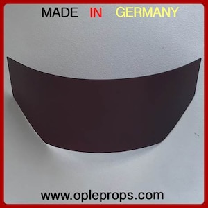 May include: A black curved piece of material with a white background. The text "MADE IN GERMANY" is printed in yellow at the top of the image. The text "www.opleprops.com" is printed in black at the bottom of the image.