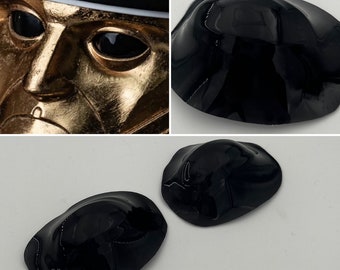 May include: Three black, glossy, eye patches with a slightly raised, textured surface. The patches are shaped like a half-circle.