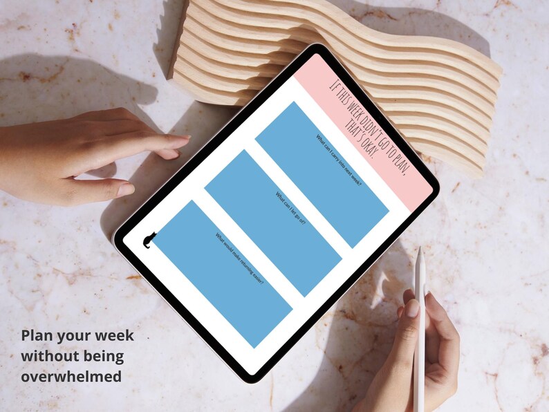 May include: A digital planner on a tablet with a pink and white border, featuring three blue boxes for weekly planning. Text on the screen reads, "If this week didn't go to plan, that's okay." The image also includes the text "Plan your week without being overwhelmed."