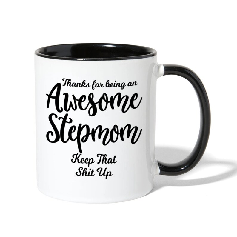 May include: White ceramic coffee mug with a black rim and handle. The mug has black text that reads "Thanks for being an Awesome Stepmom Keep That Shit Up".