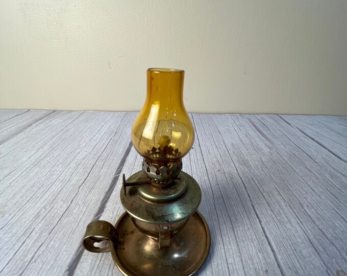 Miniature brass swivel finger oil lamp with amber chimney and wick