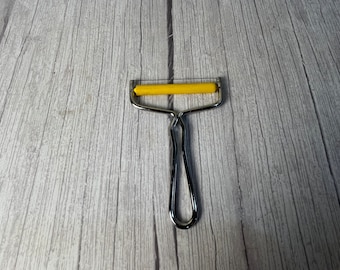 Vintage Cheese Slicer with yellow roller