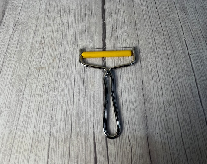 Vintage Cheese Slicer with yellow roller