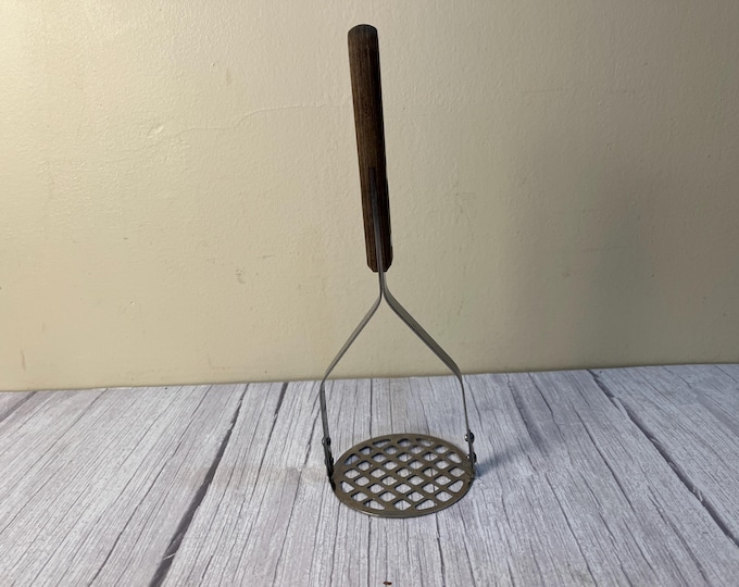 Vintage steel with wood handle potato masher