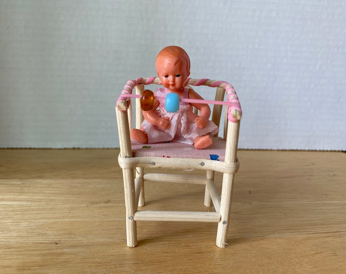 1960s German brand Caco  plastic toy baby doll in wicker Highchair