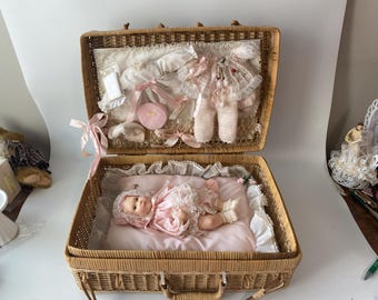 1980 NIB Pink and Frilly Effanbee "Baby Lisa" Layette Set with woven wicker suitcase, display bedding, Doll, 3 outfits, washcloth & blanket