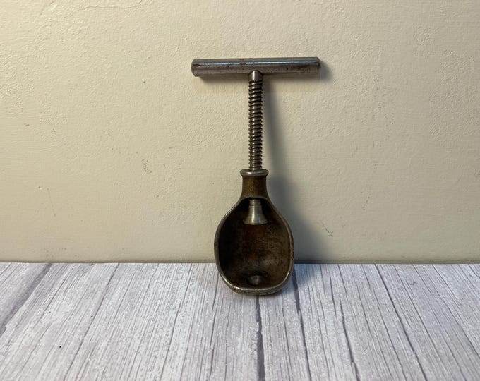 Vintage handheld twist nutcracker