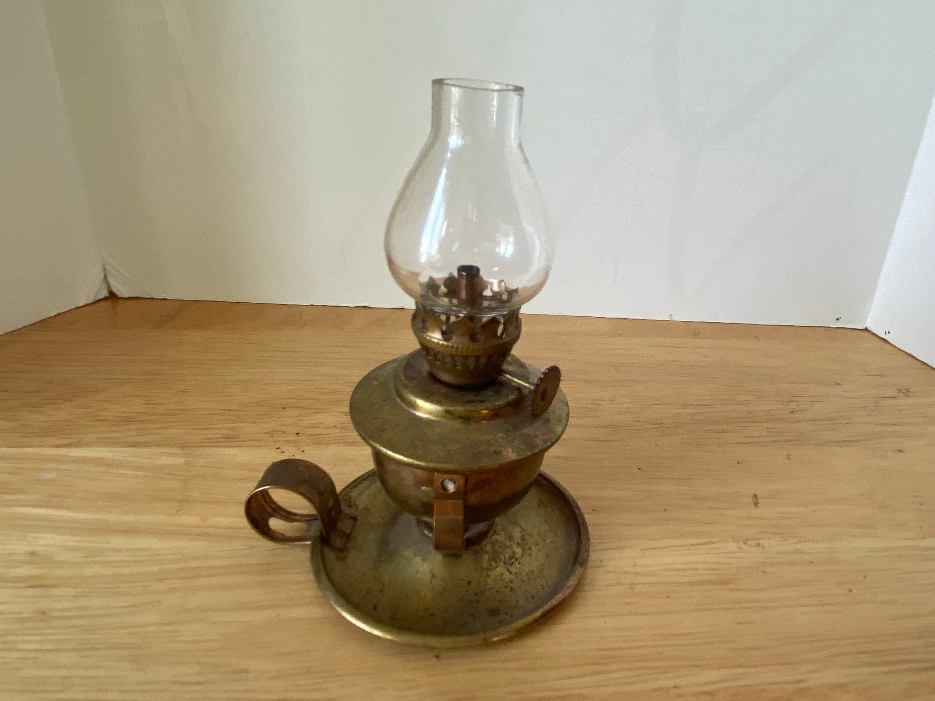 Miniature brass swivel finger oil lamp with clear chimney and wick