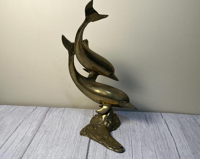 Brass pair of dolphins swimming sculpture