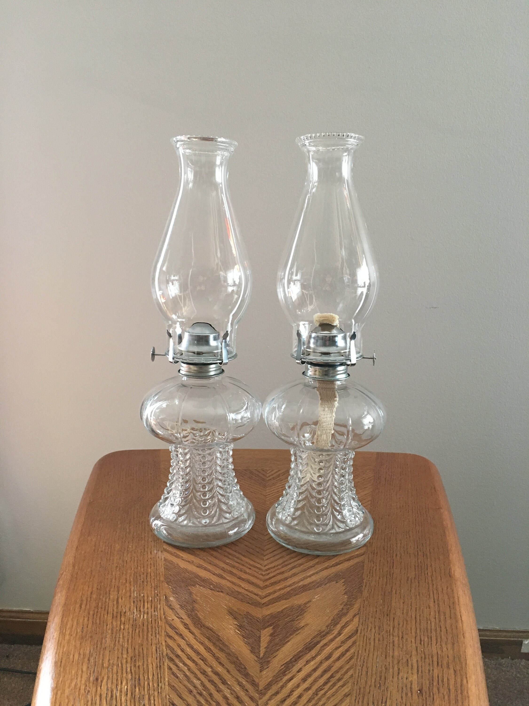 Vintage pair of Lamp Light Arms oil lamps with chimneys made in Austria