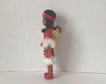 1960s Sleepy Eyed Plastic Native American Indian Woman with Twin Babies carried on her Back Souvenir Indian dolls