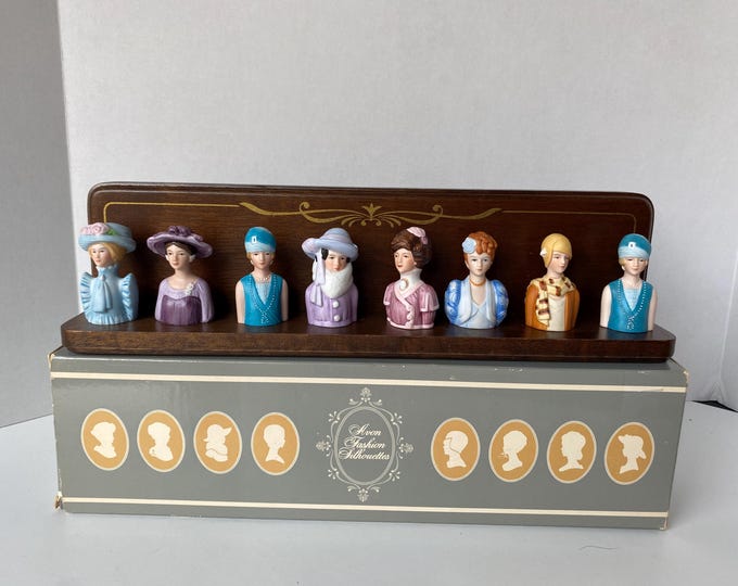 Avon American Fashion Thimble Display includes set of 8 Porcelain Busts of Women Through the Century w/wooden Display Rack original box