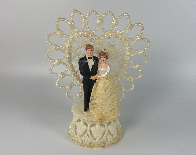 Vintage 1950-60s Coast Novelty Plastic Bride and Groom Cake Topper with White heart Arch trimmed in lace