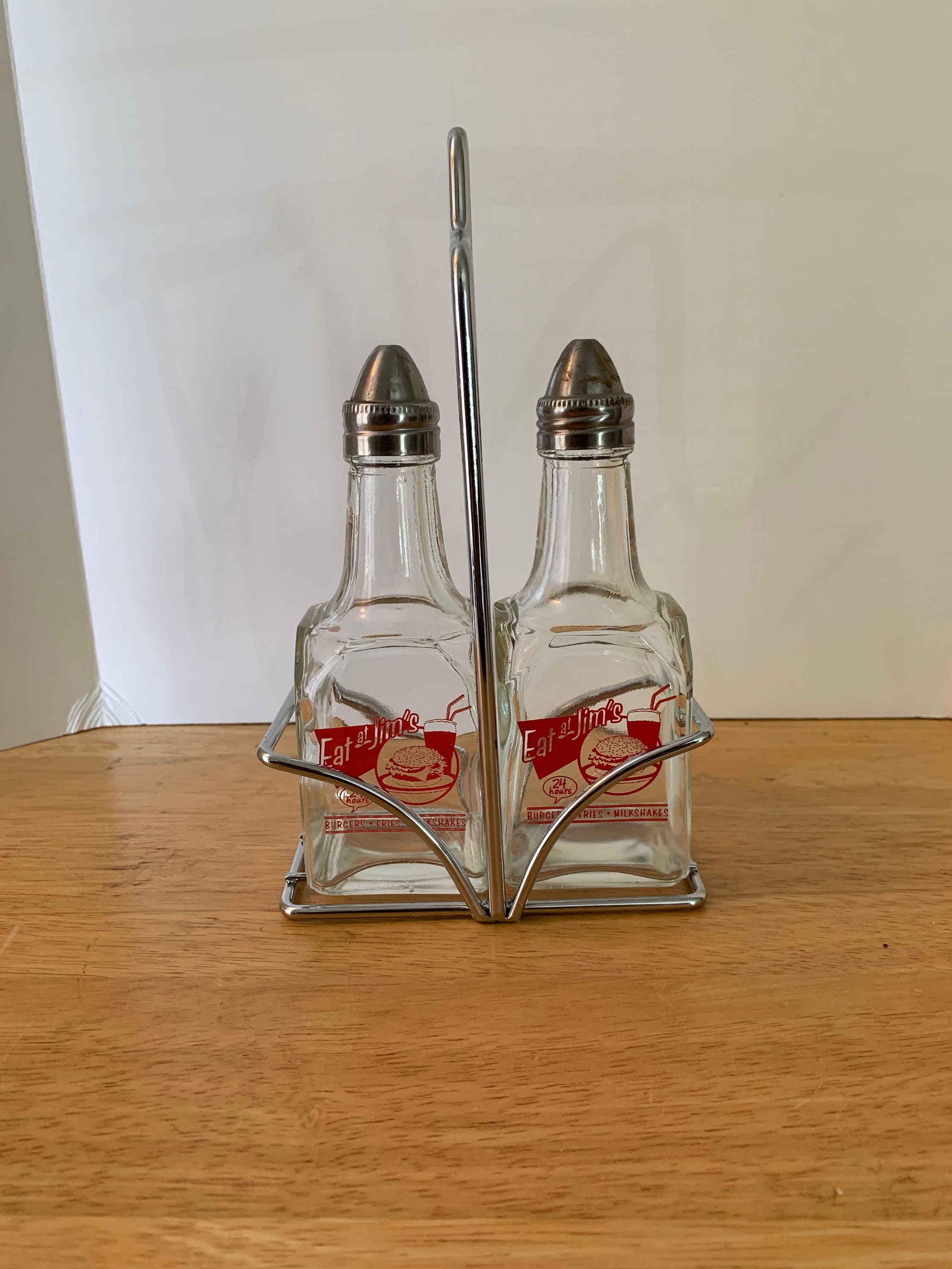 Eat at Jim's vinegar and oil dispenser with holder