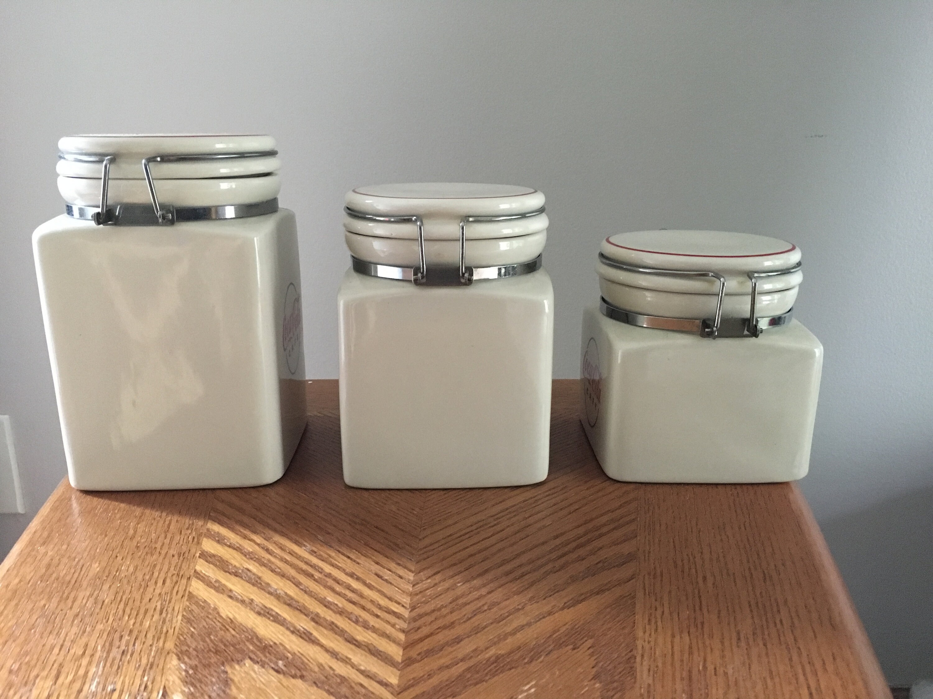 3 Piece ceramic CocCola canister set with locking lids