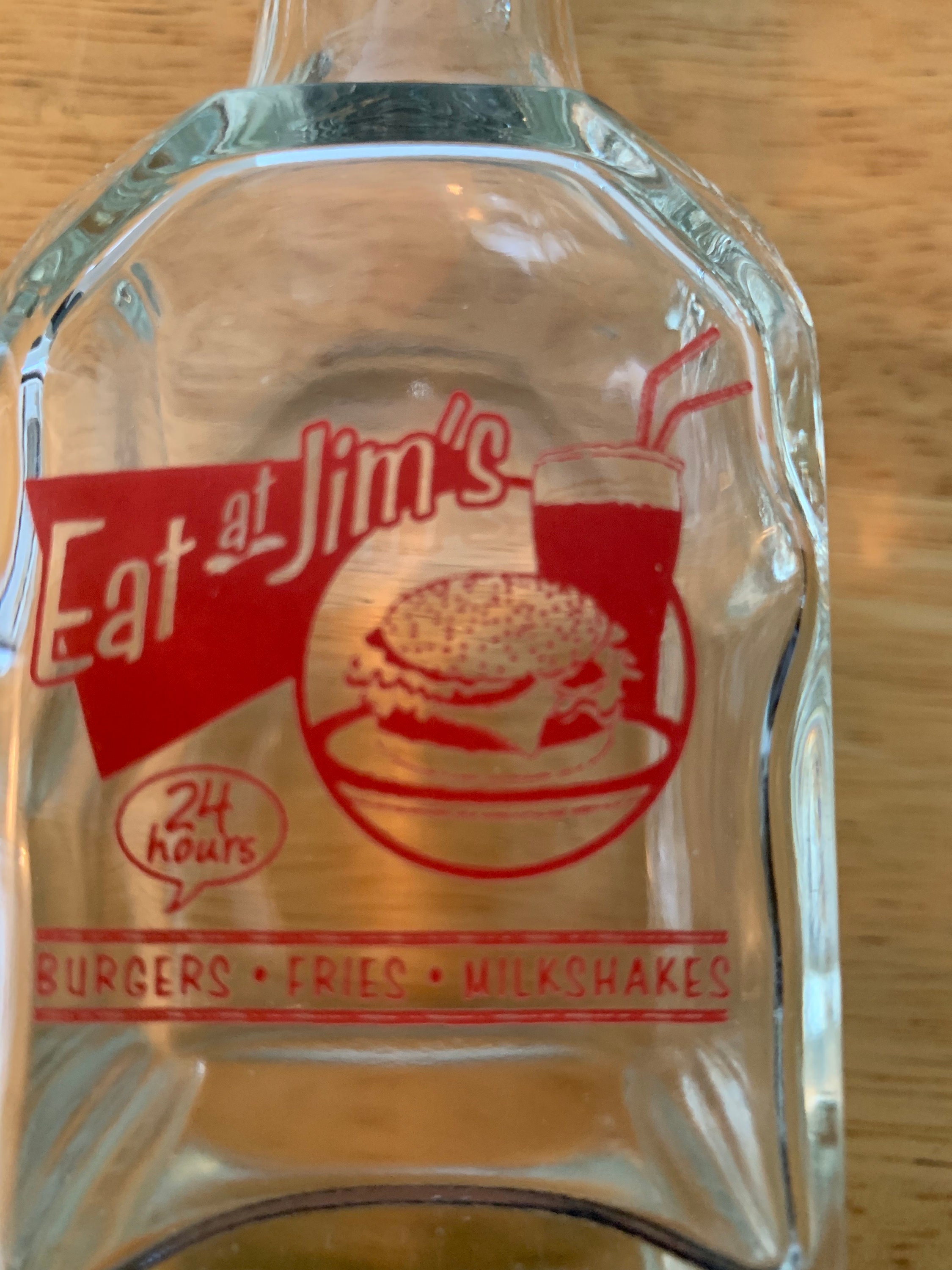 Eat at Jim's vinegar and oil dispenser with holder