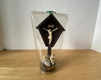 Small Vintage plastic crucifix with Jesus with a covered roof with original packaging in  excellent condition!