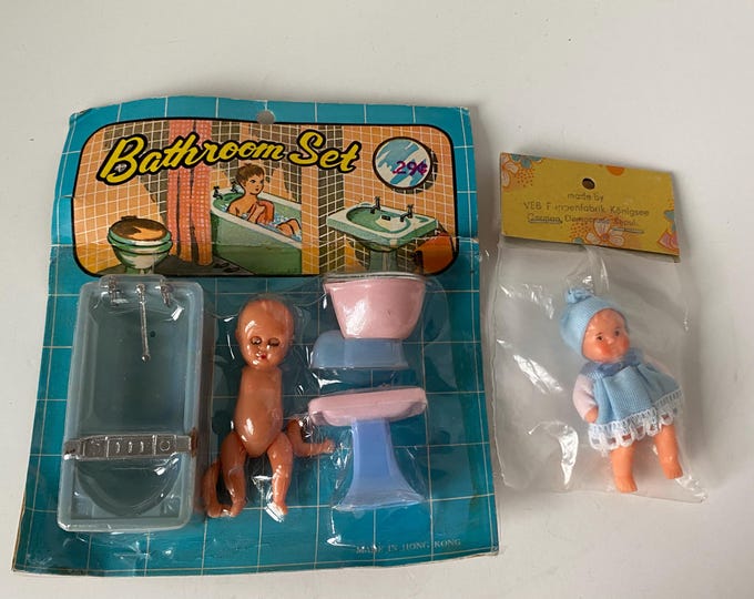 Vintage Dime Store Sleepy Eye Bathroom Doll set and  small German rubber baby doll both  new in package