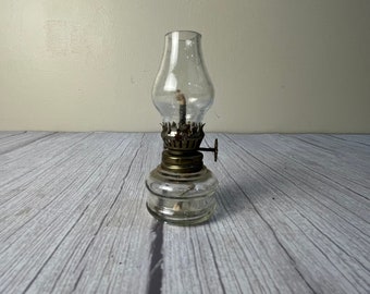 Small clear double rim round glass oil lamp with scalloped chimney and wick