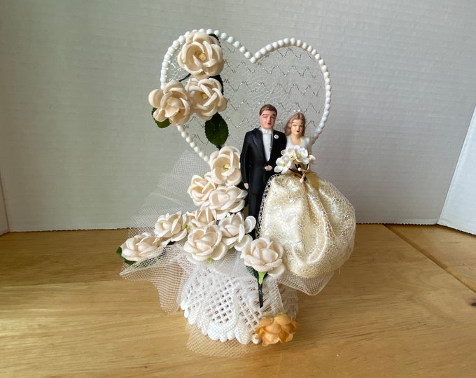 1950s-60s  Wedding Cake topper with Plaster Bride and Groom Mesh Heart faux roses on Plastic Decorative base