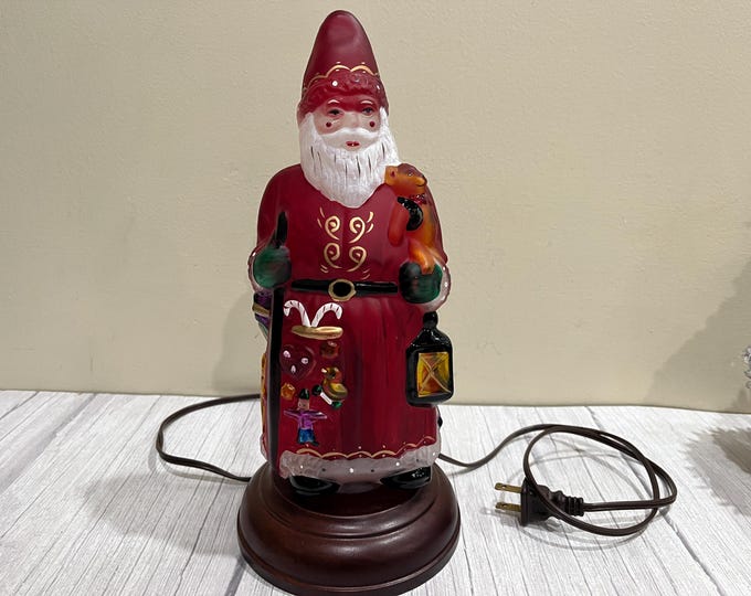 Lighted 1993's Merck family "Father Christmas with toys" by Old World Christmas