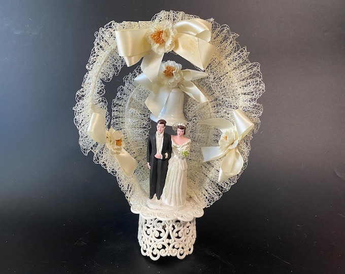 Vintage Double Laced Arch with Plaster Bride and Groom Cake Topper with bows and bell