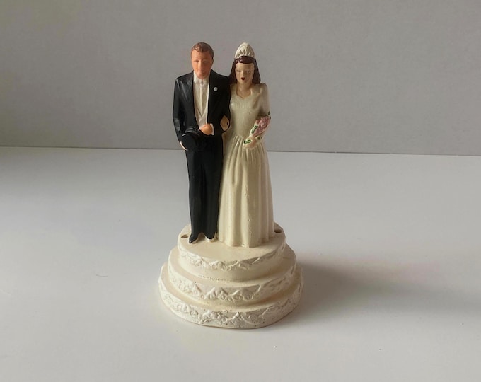 1940s Bride and Groom Chalkware Cake Topper standing on Tiered Cake