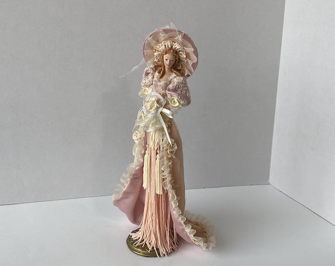 Victorian 12" tall tassel doll in Pink with long, ornate gown,  wide brim hat on antiqued brass colored stand