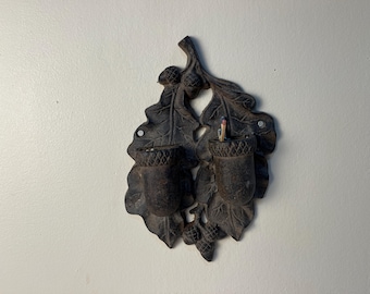 Wall mounted double acorn match holder