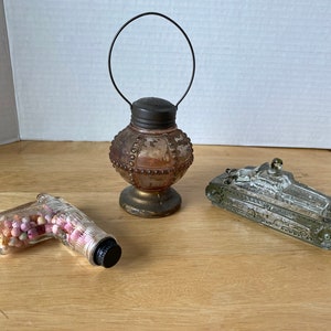 Choice of Early 1900s Candy Dispensers of army tank, pistol or rare lantern