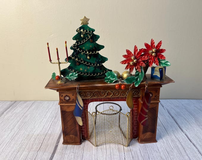 Metal fireplace scene tea light candle holder
