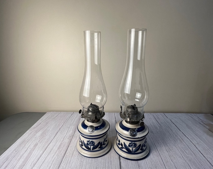 Pair Country stoneware/ceramic/porcelain oil lamp with raised flower and leaf decorations with matching clear chimneys and wicks