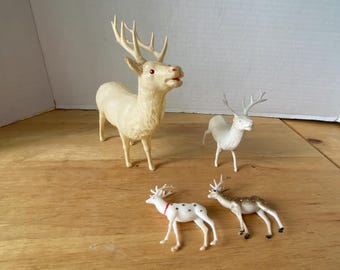 Set of 4 - Celluloid (1) and Plastic (3) Reindeer Figurines