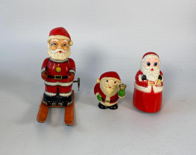 Set of 3 Vintage Mechanical Santa Figurines; Tin Litho Skiing Santa, Wind Up Hopping Santa and Friction Santa made by Fun World