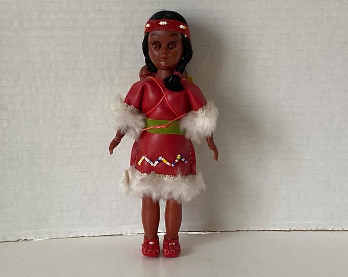 1960s Sleepy Eyed Plastic Native American Indian Woman with Twin Babies carried on her Back Souvenir Indian dolls