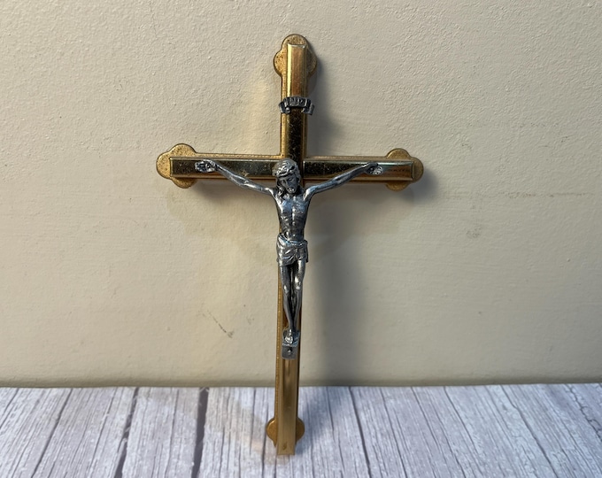 Vintage brass and gold color INRI crucifix with silver colored figure of Jesus
