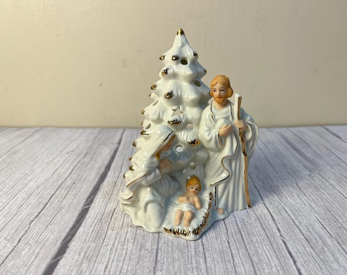 Porcelain holy family tea light candle holder with gold accents
