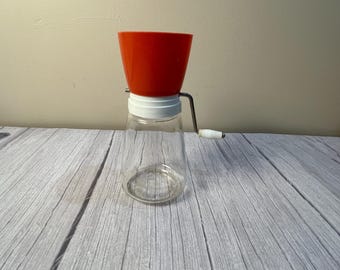 1960's orange nut grinder missing cover
