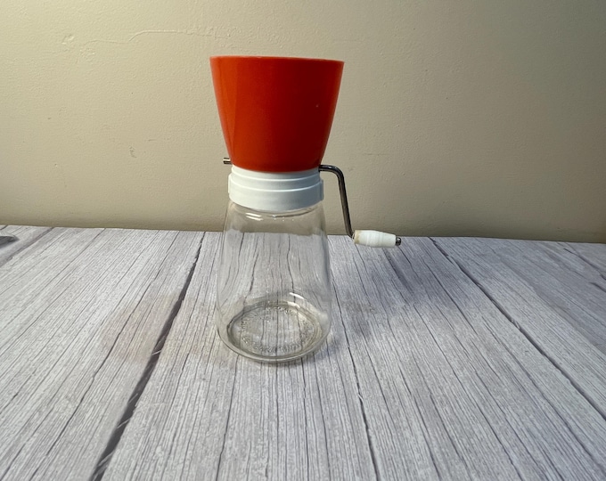 1960's orange nut grinder missing cover