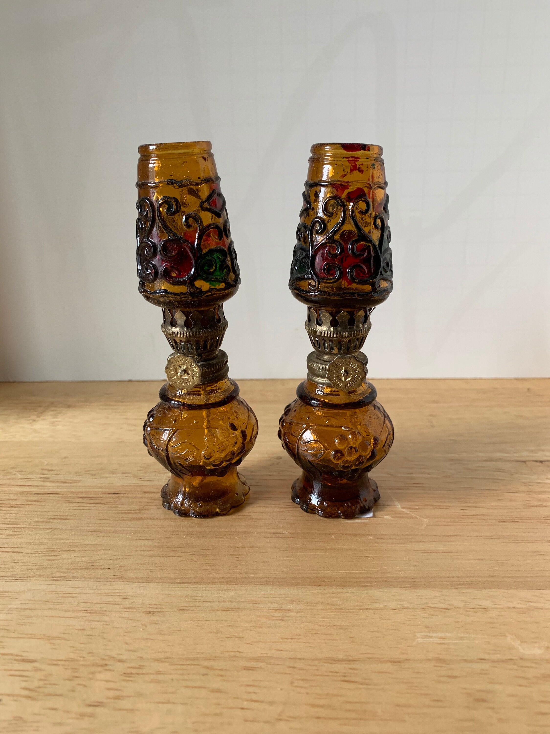 Vintage pair of brown glass oil lamps multi colored chimmneys with