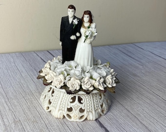 Vintage Wedding Cake topper with plastic bride and groom, plaster (or royal icing) and faux flowers on plastic base