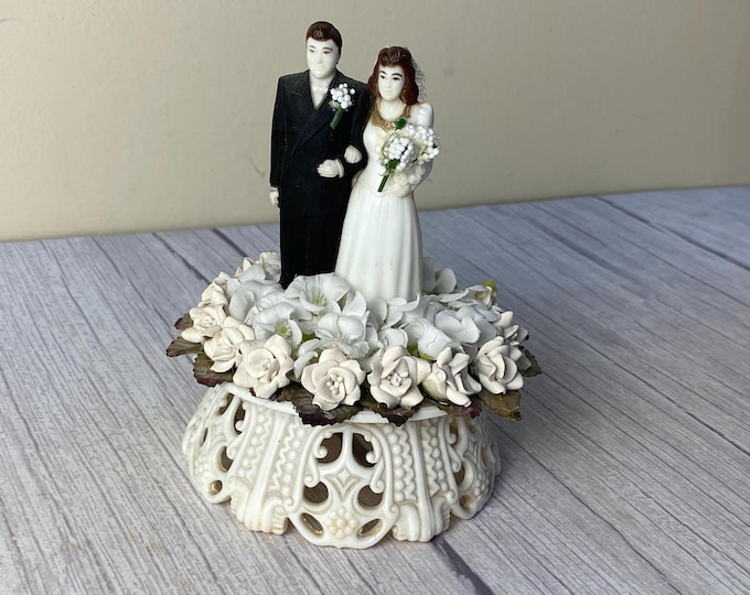 Vintage Wedding Cake topper with plastic bride and groom, plaster (or royal icing) and faux flowers on plastic base